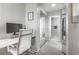 Cozy bedroom with a white desk area and a view into a closet and ensuite bathroom at 101 Fair Haven Se Way, Smyrna, GA 30080