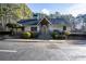 Community clubhouse with stone accents, covered entry, and professionally landscaped front yard at 101 Fair Haven Se Way, Smyrna, GA 30080