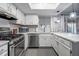Well-lit kitchen features stainless steel appliances, light countertops, and white cabinets with a modern design at 101 Fair Haven Se Way, Smyrna, GA 30080
