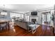 Open concept living room with fireplace, hardwood floors, and access to the kitchen at 101 Fair Haven Se Way, Smyrna, GA 30080