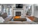 Cozy living room featuring a fireplace, plush seating, and ample natural light at 101 Fair Haven Se Way, Smyrna, GA 30080