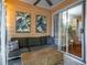 Relaxing sunroom with comfortable seating, leafy wall art, ceiling fan, and lots of light at 101 Fair Haven Se Way, Smyrna, GA 30080