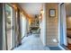 Light-filled sunroom with wall to wall sliding glass doors, tile floor, and serene outdoor views at 101 Fair Haven Se Way, Smyrna, GA 30080