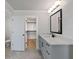 Light bathroom features a single sink vanity, ample storage, with access to the walk-in closet at 4024 Hosch Retreat Dr, Buford, GA 30519