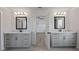 Bright bathroom features dual vanities, stylish mirrors, and an en suite bathroom at 4024 Hosch Retreat Dr, Buford, GA 30519