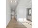 Bright hallway with light wood flooring, white trim, and modern lighting fixtures at 4024 Hosch Retreat Dr, Buford, GA 30519