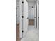 Bright hallway with tile flooring offers access to the bedroom and bathroom at 4024 Hosch Retreat Dr, Buford, GA 30519