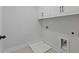 Functional laundry room with storage cabinets and tile flooring ready for appliances at 4024 Hosch Retreat Dr, Buford, GA 30519