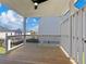 Back porch features wooden flooring, and an outdoor space to relax and enjoy the surroundings at 4024 Hosch Retreat Dr, Buford, GA 30519