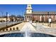Downtown community view featuring a water fountain, streetscape, and brick architecture at 16 Jacobs Farm Ln # 8, Lawrenceville, GA 30045