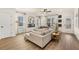 Bright living room with a modern fireplace, large windows with backyard views, and sleek ceiling fan at 16 Jacobs Farm Ln # 8, Lawrenceville, GA 30045