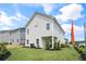 Exterior rear view of home showcasing the patio, manicured lawn, and the home's vinyl siding at 720 Shetland Trl, Cartersville, GA 30121
