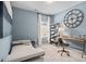 Stylish bedroom with a daybed, a wooden desk, a large decorative clock, and neutral walls at 720 Shetland Trl, Cartersville, GA 30121