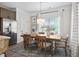 Elegant dining room with a large table, stainless steel refrigerator, and ample natural light at 720 Shetland Trl, Cartersville, GA 30121