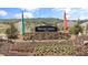 Highland Crossing neighborhood entrance sign surrounded by colorful landscaping and community flags at 720 Shetland Trl, Cartersville, GA 30121
