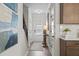 Bright hallway featuring wood floors, staircase, and access to various rooms at 720 Shetland Trl, Cartersville, GA 30121