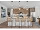Well-equipped kitchen with a center island, modern appliances, and stylish pendant lighting at 720 Shetland Trl, Cartersville, GA 30121