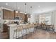 Bright kitchen features a center island with bar stool seating and stainless steel appliances at 720 Shetland Trl, Cartersville, GA 30121