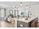 Open kitchen flows into a spacious living room with lots of natural light at 720 Shetland Trl, Cartersville, GA 30121