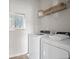 A clean and well-organized laundry room with a washer and dryer at 720 Shetland Trl, Cartersville, GA 30121