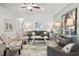 Comfortable living room with a ceiling fan, ample seating, and stylish decorations at 720 Shetland Trl, Cartersville, GA 30121