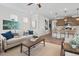 Open living space with a comfortable sofa and kitchen island with bar seating at 720 Shetland Trl, Cartersville, GA 30121