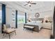 Beautifully decorated main bedroom featuring a tray ceiling, neutral walls, a ceiling fan, and great natural light at 720 Shetland Trl, Cartersville, GA 30121