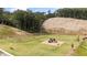 Community playground with slides and climbing structures is surrounded by a fenced perimeter at 720 Shetland Trl, Cartersville, GA 30121