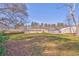 Large backyard features a wooden fence and a deck, ideal for outdoor enjoyment at 1408 Lake Paradise Rd, Villa Rica, GA 30180