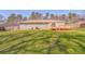 Expansive grassy backyard featuring a cozy wooden deck and a neutral-toned home at 1408 Lake Paradise Rd, Villa Rica, GA 30180