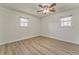 Bedroom featuring new wood flooring, neutral walls, ceiling fan, and windows with blinds at 1408 Lake Paradise Rd, Villa Rica, GA 30180