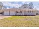 Charming single-story home featuring a spacious yard and a convenient two-car garage at 1408 Lake Paradise Rd, Villa Rica, GA 30180