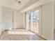 Bright, sun-filled living room features sliding glass doors to deck and convenient outdoor access at 1408 Lake Paradise Rd, Villa Rica, GA 30180