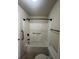 Bathroom featuring accessible bathtub, handrails, and updated fixtures at 651 Deer Springs Way, Loganville, GA 30052