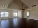 Large bedroom showcasing tray ceiling, ceiling fan, hardwood floors, and plenty of natural light at 651 Deer Springs Way, Loganville, GA 30052