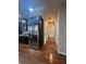 Open-concept kitchen featuring a stainless steel refrigerator and dark wood cabinets at 651 Deer Springs Way, Loganville, GA 30052