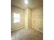 Dedicated laundry room offering tile floors and a utility sink at 651 Deer Springs Way, Loganville, GA 30052