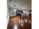 Open living space with modern lighting and gleaming hardwood floors at 651 Deer Springs Way, Loganville, GA 30052