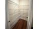 Walk-in pantry equipped with white wire shelves for optimal organization at 651 Deer Springs Way, Loganville, GA 30052