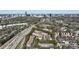 The aerial view of the apartments shows lush trees, highway access, and the Atlanta skyline at 2700 Pine Tree Ne Rd # 4006, Atlanta, GA 30324