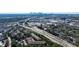 This aerial shot shows the property near a highway, shopping, and with views of the Atlanta skyline at 2700 Pine Tree Ne Rd # 4006, Atlanta, GA 30324