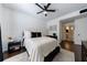 Well-lit bedroom with a ceiling fan, a large bed, and an ensuite bathroom at 2700 Pine Tree Ne Rd # 4006, Atlanta, GA 30324