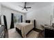 Comfortable bedroom featuring a window, a ceiling fan, and neutral decor at 2700 Pine Tree Ne Rd # 4006, Atlanta, GA 30324