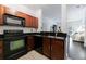 Stylish kitchen with granite countertops, modern appliances, and an open layout leading to the living space at 2700 Pine Tree Ne Rd # 4006, Atlanta, GA 30324