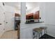 Galley kitchen with stainless steel refrigerator and dark granite countertops, plus breakfast bar at 2700 Pine Tree Ne Rd # 4006, Atlanta, GA 30324