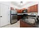 The kitchen features stainless steel appliances, granite countertops, and ample cabinet space at 2700 Pine Tree Ne Rd # 4006, Atlanta, GA 30324