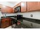 Kitchen with granite countertops, and modern black cooktop, wall oven, and microwave at 2700 Pine Tree Ne Rd # 4006, Atlanta, GA 30324