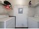 Functional laundry room with dual washing machines and ample shelving for storage at 2700 Pine Tree Ne Rd # 4006, Atlanta, GA 30324