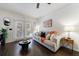 Bright living room features dark hardwood floors and stylish contemporary furnishings for comfortable living at 2700 Pine Tree Ne Rd # 4006, Atlanta, GA 30324