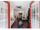 Bright living room featuring hardwood floors and a view to the dining area and kitchen through the doorway at 2700 Pine Tree Ne Rd # 4006, Atlanta, GA 30324